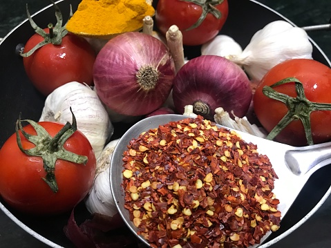 Tomatoes, onions and Garlic are the primary ingredients of most Indian curries. Turmeric and Red Chilly are added for making the dishes more spicy and flavourful.