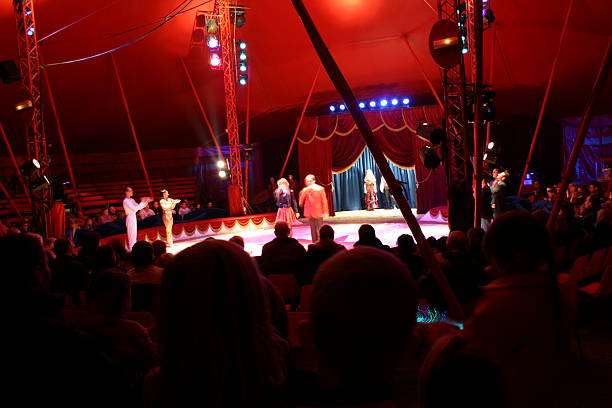 istock Circus performers and audience inside the big top 139267189