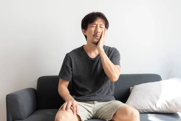 istock Adult asian man suffer from sensitive toothache. 1392672137