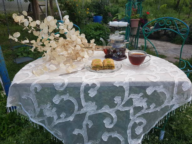 Food and drinks arranged on a garden table in the home garden