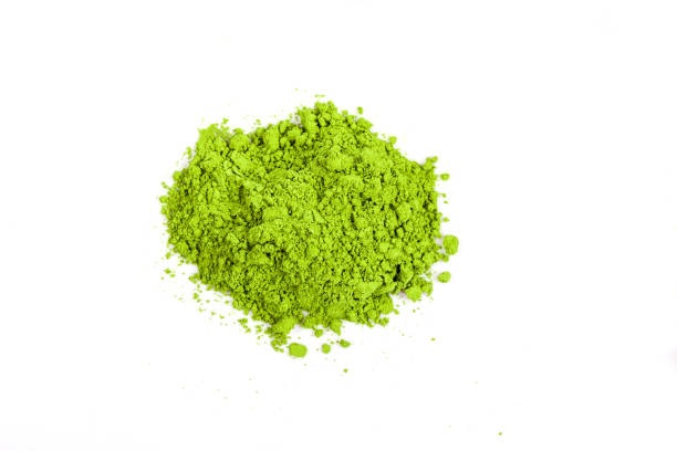 istock Top view green matcha tea powder isolated on white background 1392673550