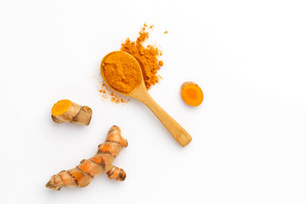 istock Turmeric powder and turmeric root isolated on white background ,Top view 1392673551