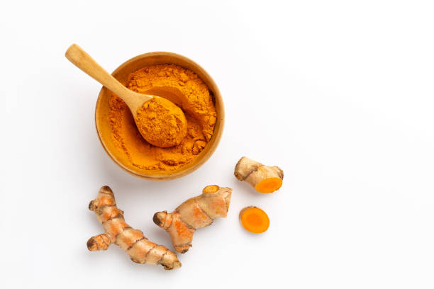 istock Turmeric powder and turmeric root isolated on white background ,Top view 1392673560