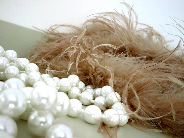 Feathers and pearls stock photo