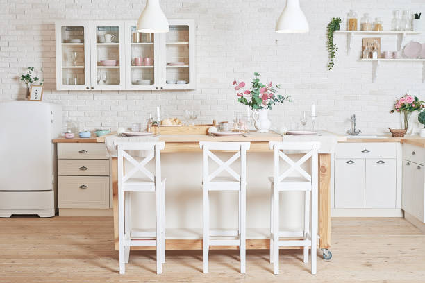 istock White kitchen in interior loft style. Valentine's day kitchen decor. Kitchen utensils and shelves. 1392676494