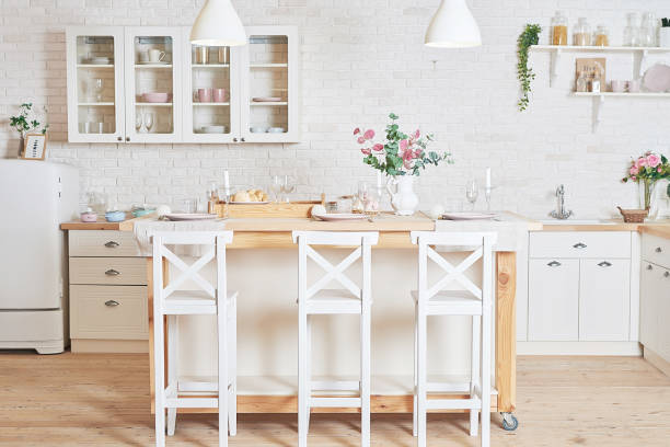 istock White kitchen in interior loft style. Valentine's day kitchen decor. Kitchen utensils and shelves. 1392676495