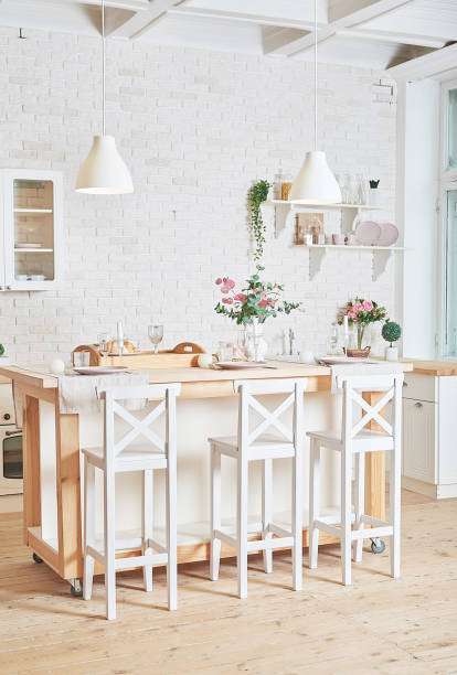 istock White kitchen in interior loft style. Valentine's day kitchen decor. Kitchen utensils and shelves. 1392676513