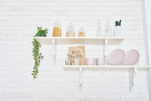 istock White kitchen in interior loft style. Valentine's day kitchen decor. Kitchen utensils and shelves. 1392676525