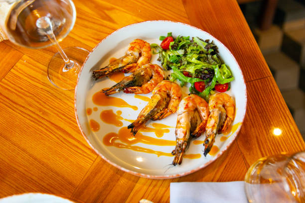 istock Appetizing fried shrimp in mustard sauce with fresh vegetables 1392679891