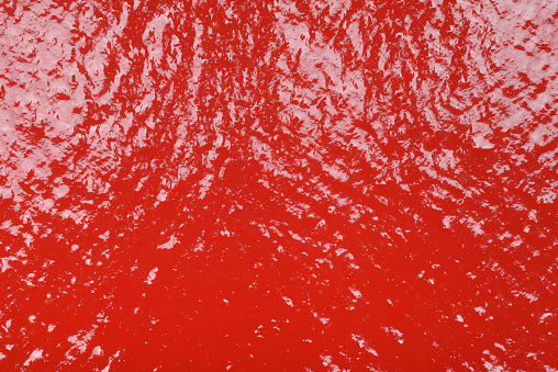 Red tomato sauce ketchup texture background close up