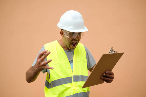 istock Works manager shouts in despair as he checks some data on his clipboard. 1392680780
