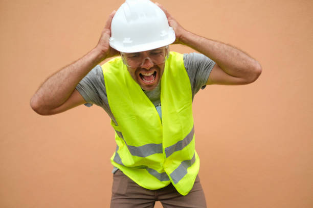 istock Desperate foreman screaming with his hands on his head. 1392680786
