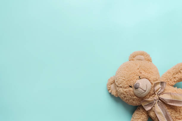 istock teddy bear on the turquoise floor closeup 1392681862