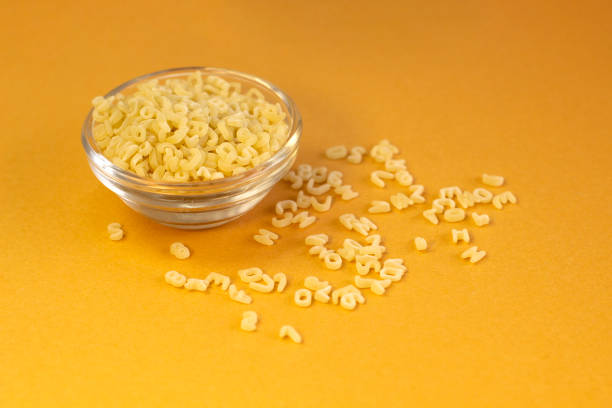 background of small pasta in the form of the Latin alphabet