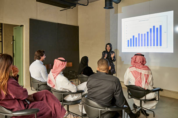 istock Associates listening to project manager presenting data 1392683033