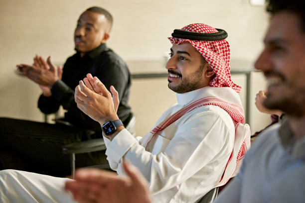 istock Riyadh businessmen clapping at conclusion of presentation 1392683055