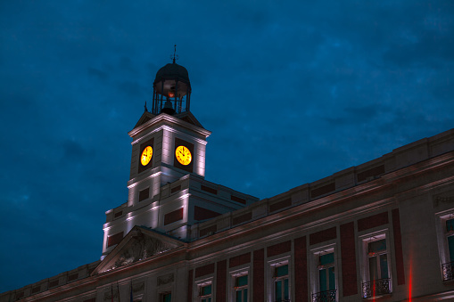 Horology at architecture tower . Clock Tower of Sun Gate in Madrid Spain . Real Casa de Correos at Puerta del Sol