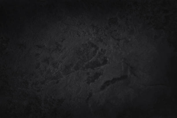 istock Dark grey black slate texture in natural pattern with high resolution for background and design art work. Black stone wall. 1392686780