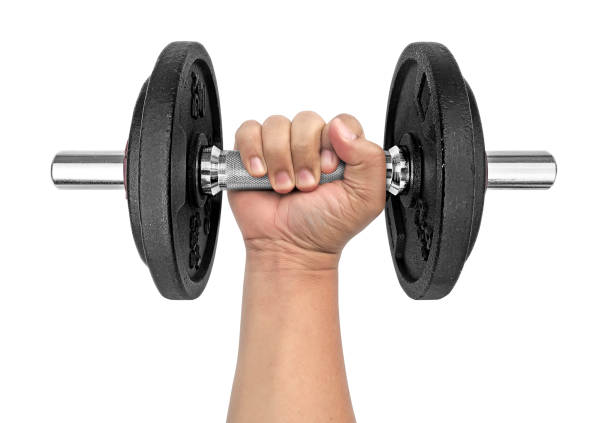 istock Hand holding dumbbell on isolated white background 1392686795