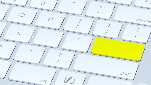 istock close up White keyboard Yellow button. Concept of New Beautiful close up Yellow keyboard button 1392691720