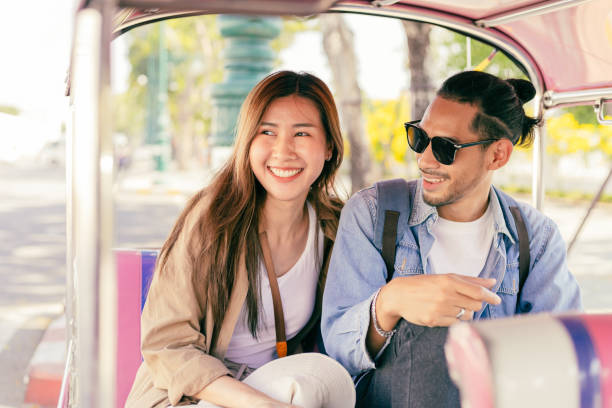 Young Asian tourists exploring Bangkok.