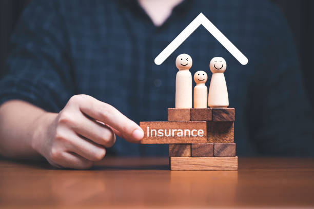 istock Family standing on wooden block  with hand pulling block which print screen insurance on it for assurance life and asset concept. 1392691925