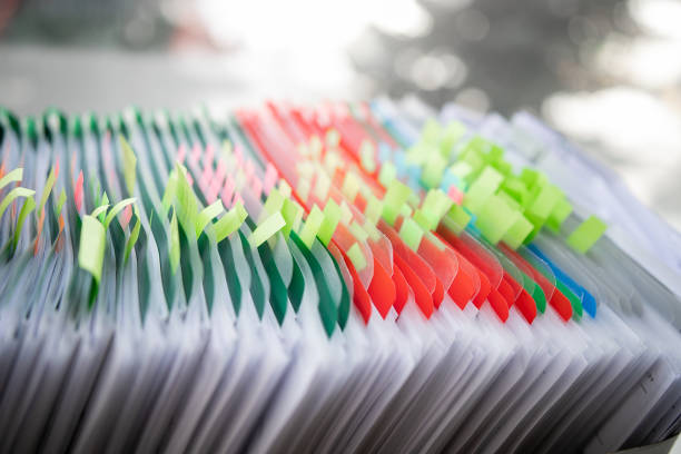 istock Pile of unfinished documents on office desk, Stack of business paper 1392694790