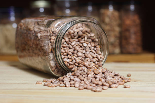 istock Jar of Pinto Beans Spilled on Kitchen Table 1392697202