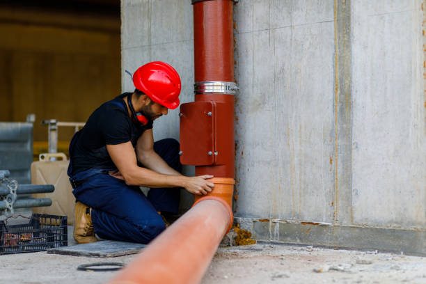 istock A Young Plumber is Fixing a Water Pipe at a Building Site. 1392697479