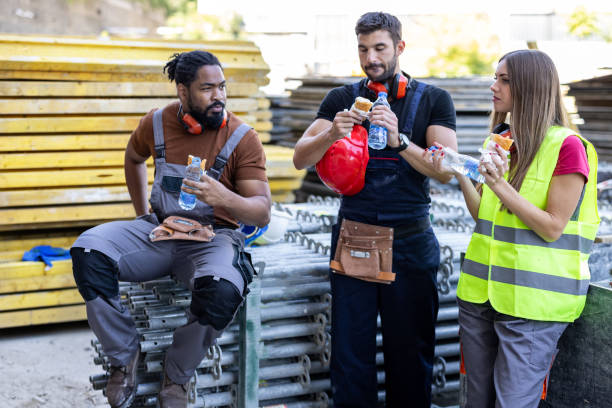 istock Multicultural Group of Building Workers are Taking a Rest and Refreshing with Food and Drink. 1392697763