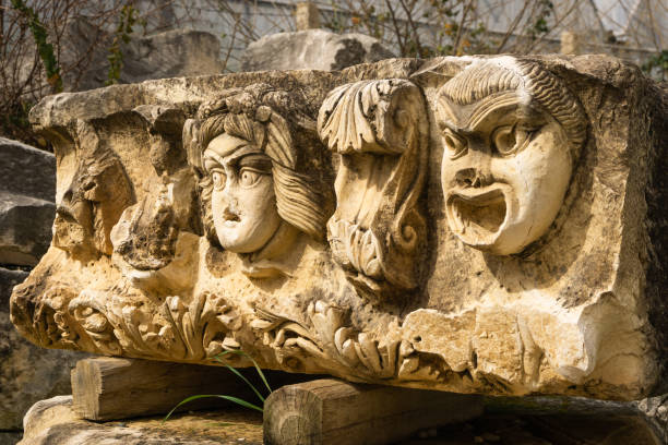istock Stone Theater masks in Myra Ancient City 1392698344