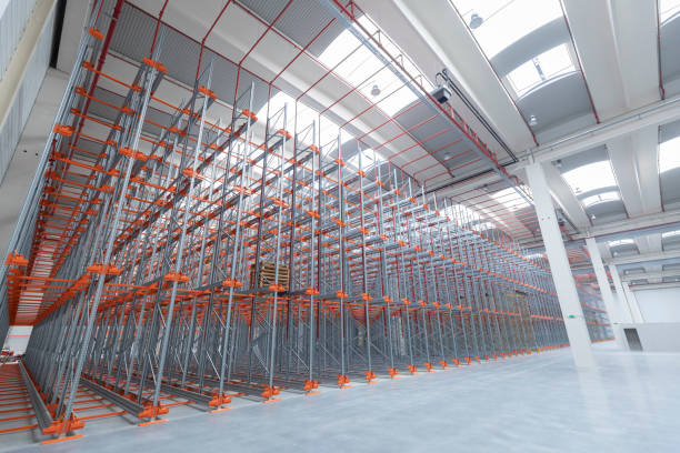 istock Industrial construction and roof in an empty warehouse 1392701456