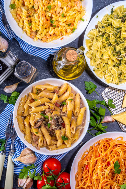 istock Set of cooked pasta with different sauces 1392706303