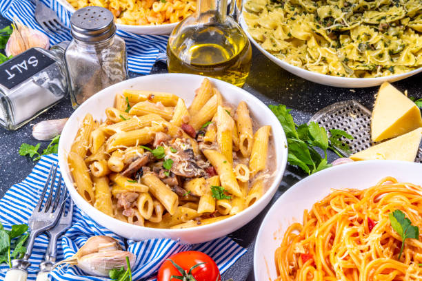 istock Set of cooked pasta with different sauces 1392706340