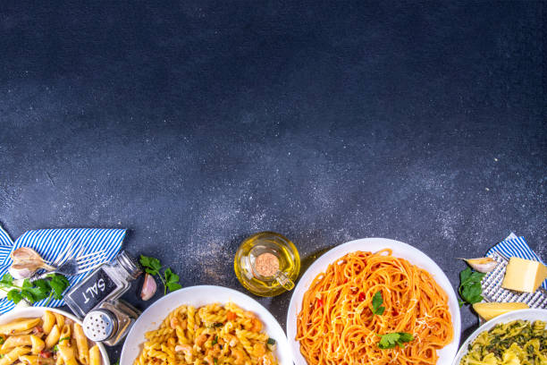 istock Set of cooked pasta with different sauces 1392706364