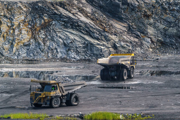 istock Dump truck in limestone mining, heavy machinery. Mining in the quarry. 1392706943