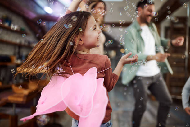 istock Joyful little girl having fun while dancing at home. 1392707276