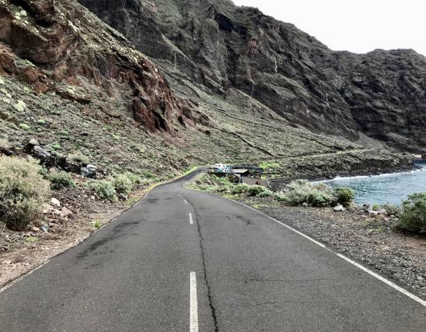 istock Coastal road on volcanic island 1392708328