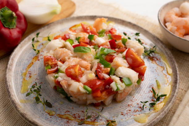 Seafood splash with hake and prawns. Spanish traditional tapas. Seafood splash with hake and prawns. Spanish traditional tapas. seafood salad stock pictures, royalty-free photos & images