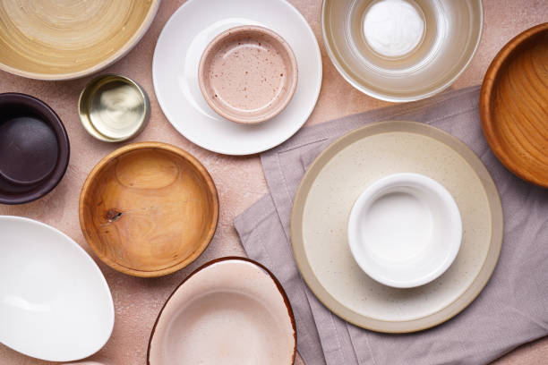 Ceramic tableware on beige background, closeup, top view. stock photo
