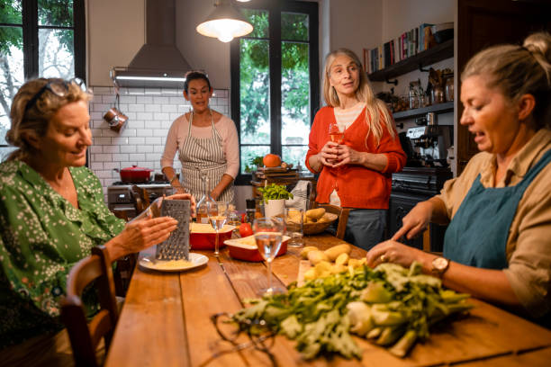 istock Mature Women Cooking Together 1392711375