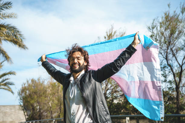 istock Excited man with LGBT flag 1392711459