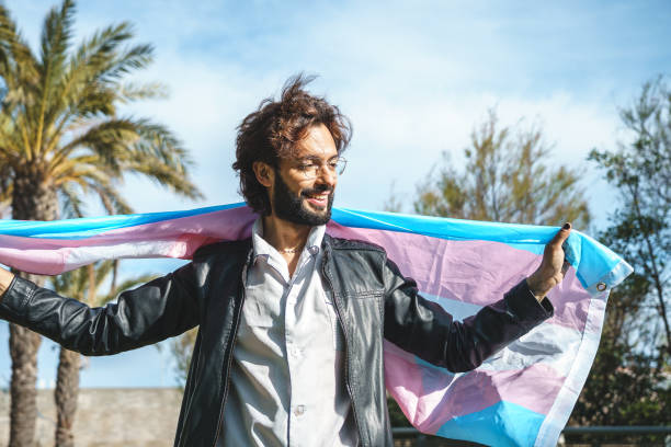 istock Happy man with LGBT flag 1392711664