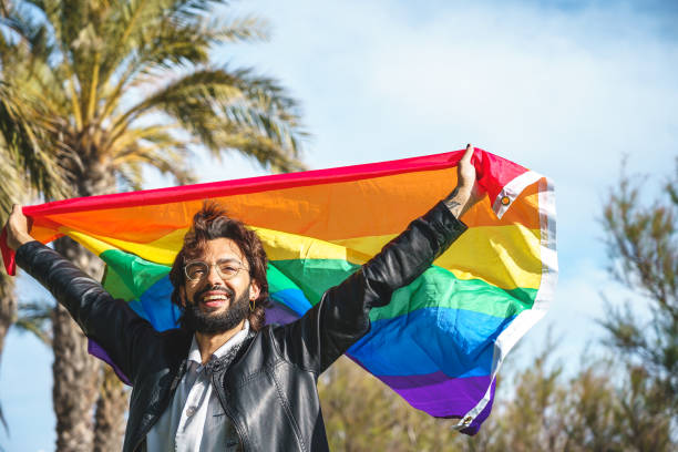 istock Joyful gay with LGBT flag 1392712597