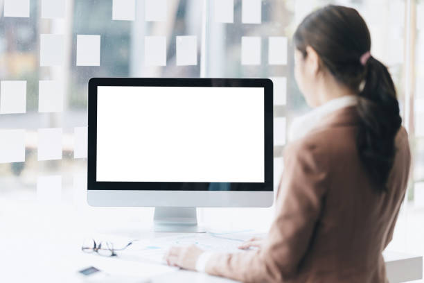 istock Front view of Mock up computer and office supplies gadget. Blank screen for graphic display montage 1392712709
