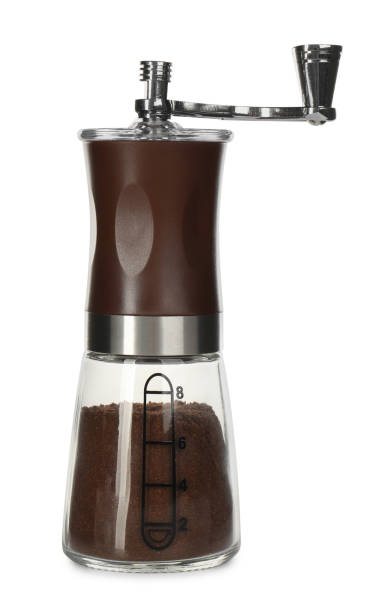 istock Modern manual coffee grinder with powder isolated on white 1392713185