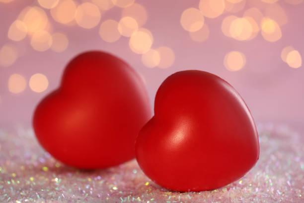 Valentine's Day background with red hearts on red background with copy space