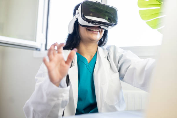 istock happy cardiologist sitting in front of a computer wearing virtual reality glasses 1392714357
