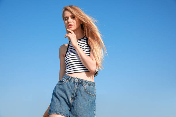 istock Beautiful young woman outdoors on sunny day 1392714858