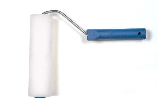 istock Foam roller for painting walls on a white background. 1392715417
